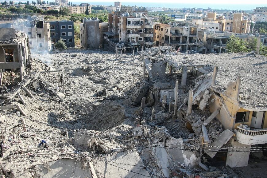 A photograph shows the aftermath of Israeli airstrikes in the Burj al-Chamali area near the southern Lebanese city of Tyre