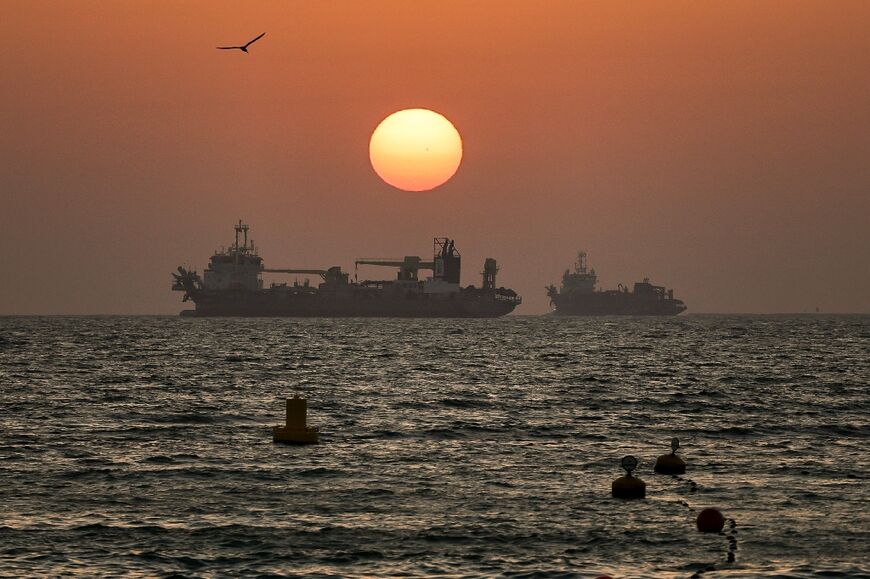 The United States said it shot down a pair of Iranian drones threatening the Strait of Hormuz