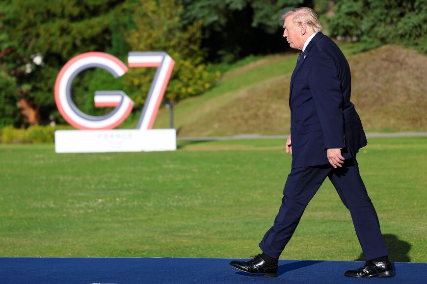 US President Donald Trump arrives for the official greeting during the G7 summit, in Evian, eastern France