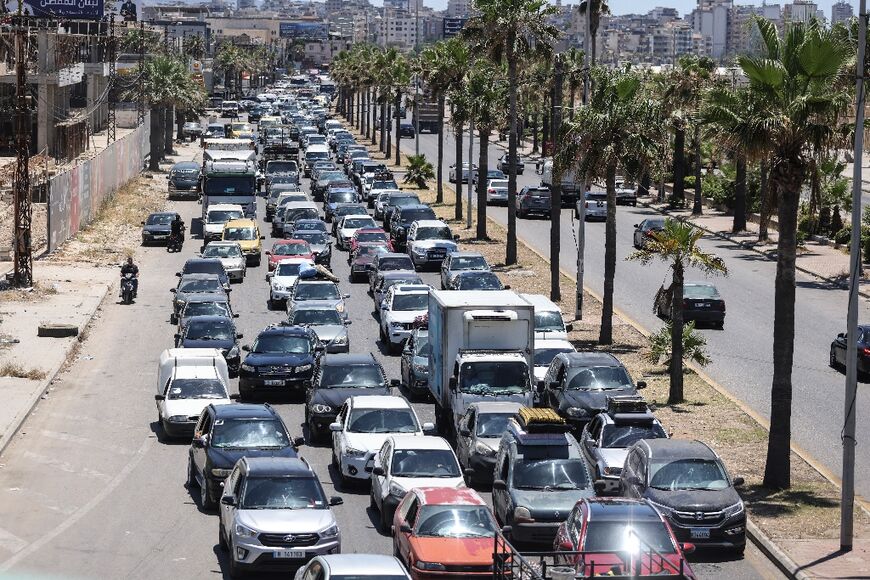 Traffic pours into the city of Sidon on Friday after a wave of strikes that sent many residents of the south fleeing