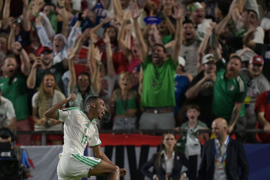 Algeria's defender #17 Rafik Belghali celebrates scoring his team's first goal during the 2026 World Cup Group J football match between Algeria and Austria at the Kansas City Stadium in Kansas City on June 27, 2026. (Photo by JUAN MABROMATA / AFP via Getty Images)