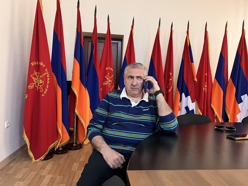 Artur Khachatryan, a lawmaker for the opposition Armenia Alliance, works the phones at his party's headquarters in Yerevan, Armenia, on May 27, 2026. (Amberin Zaman/Al-Monitor)