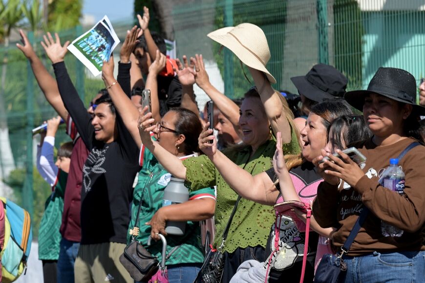 Mexican supporters hope to lift the spirits of the Iran side whose World Cup campaign has been partly overshadowed by war
