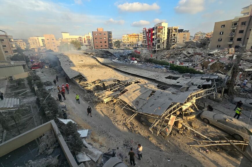 First responders gather at the site of the hospital car park after an Israeli strike hit nearby