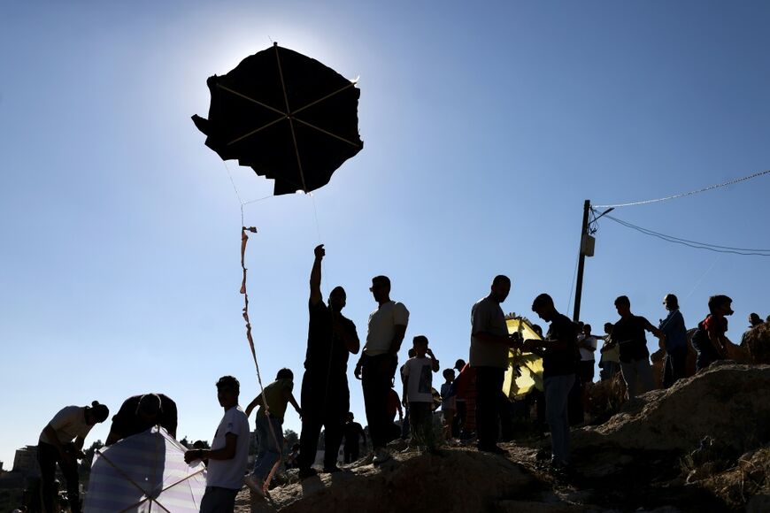 Palestinians from the village of Burin in the Israeli-occupied northern West Bank celebrate the annual kite festival, saying it was their defiance against Israeli settlers in the area