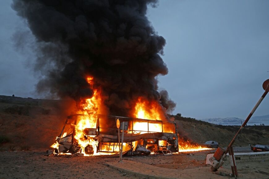 Fires engulfed dozens of cars including informal taxis in which these people had arrived the previous day