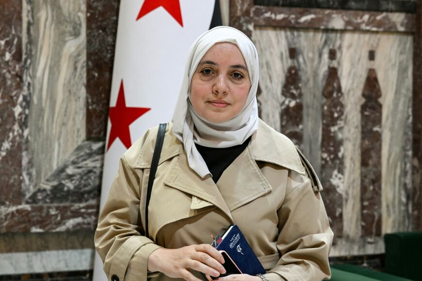 Syria's member of parliament Nour Jandali poses inside one of the halls of the parliament in Damascus on July 27, 2026