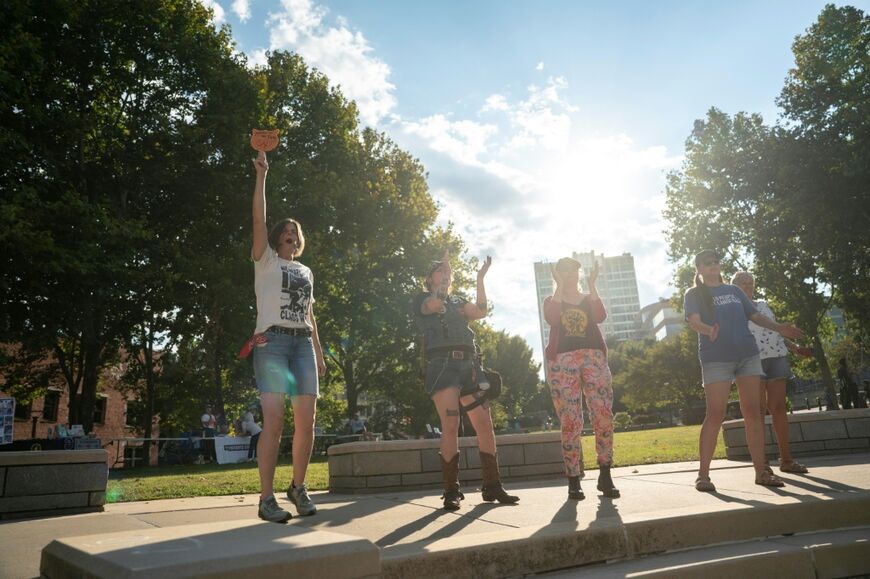 People cheer at a protest against the G20 finance ministers and central bank governors’ meeting in Asheville, North Carolina