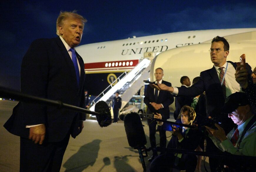 US President Donald Trump talks with the media before boarding Air Force One at Los Angeles International Airport on August 4, 2026 in Los Angeles, California
