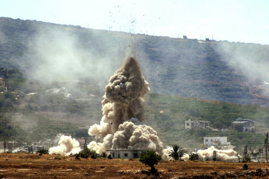 Smoke rises from the site of an Israeli airstrike that targeted the village of al-Mansouri in Lebanon