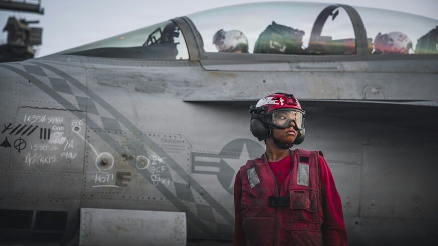 This handout picture released by the US Navy on September 13, 2026, shows a US Sailor after checking ordnance on an F/A-18 Super Hornet, attached to Strike Fighter Squadron (VFA) 102, on the flight deck of Nimitz-class aircraft carrier USS George Washington (CVN 73) on September 13, 2026. President Donald Trump has repeatedly brushed off concerns of depleted weapons stores during the six months of war in the Middle East, saying recently that the US has "virtually unlimited" ammunition.