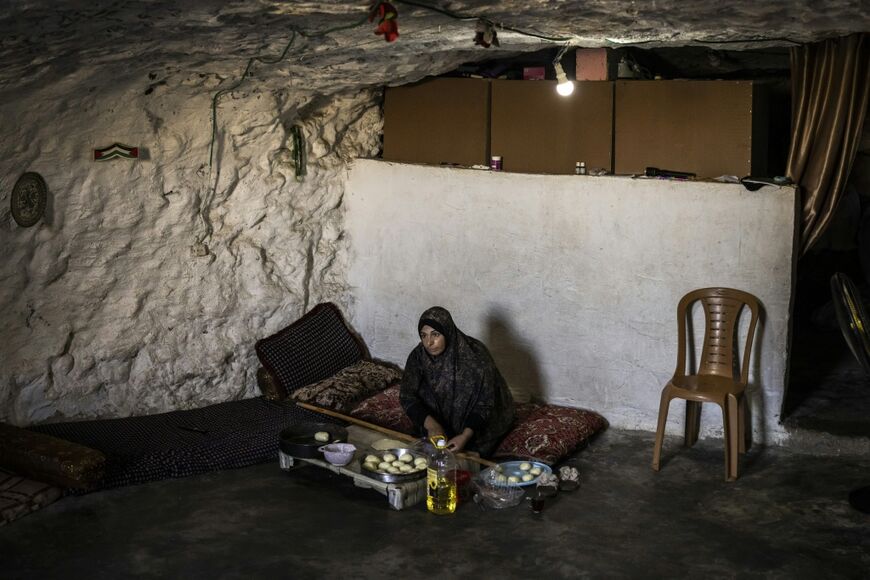 "We once lived in a house above ground, where you could see the world. But today, we live in an underground cave that resembles a grave," Emar said