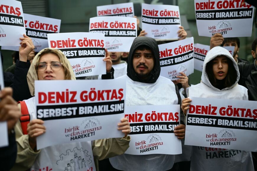 Protesters gathered outside court with placards reading: 'Release Deniz Goktas'