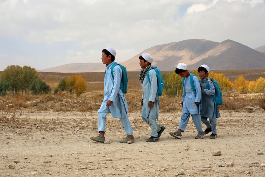 Pupils walking to school in Sarab district in Afghanistan's Ghazni province