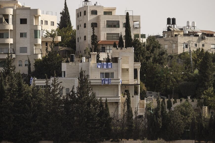 Israeli flags were draped on a house apparently taken over by troops