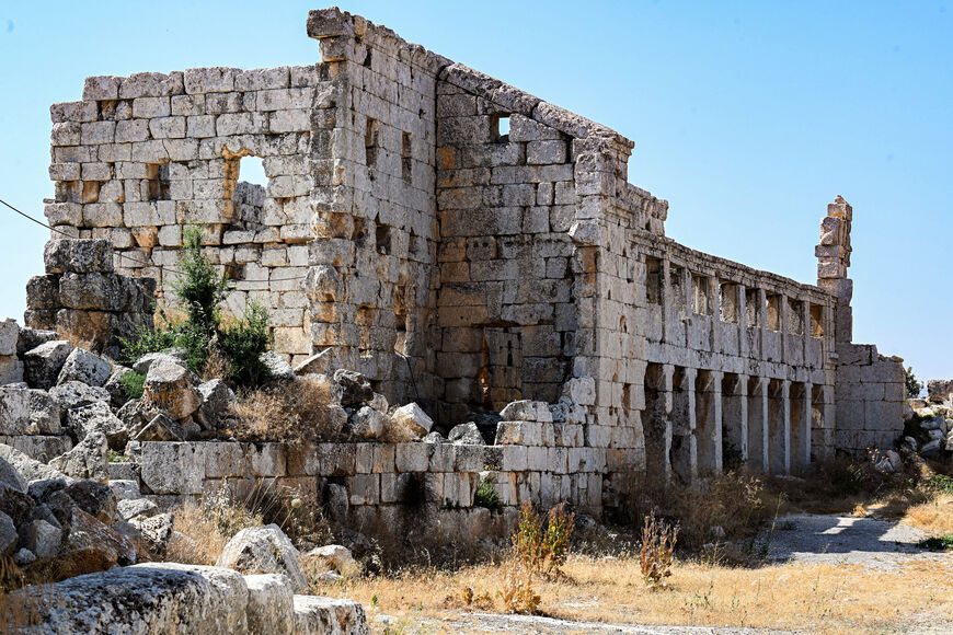 The ruins of the fifth century Church of Saint Simeon Stylites are pictured at the site about 30 kilometers northwest of Aleppo in northern Syria on July 18, 2026, during a tour with representatives of the French embassy to assess damages in the wake of the Syrian Civil War. (Photo by Louai Beshara/AFP via Getty Images)