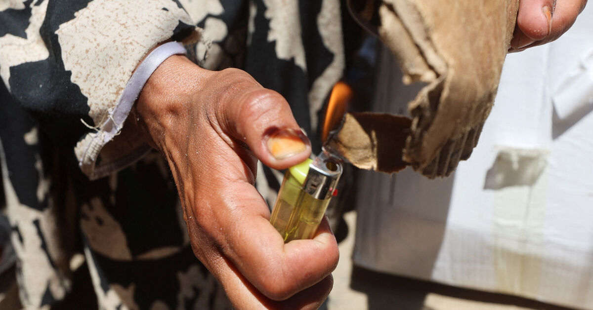 In Gaza's tent camps, a cigarette lighter becomes a lifeline