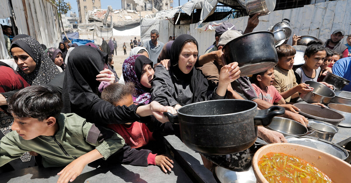 Palestinians gather to receive food from a charity kitchen, in Gaza City, June 2, 2026. REUTERS/Dawoud Abu Alkas