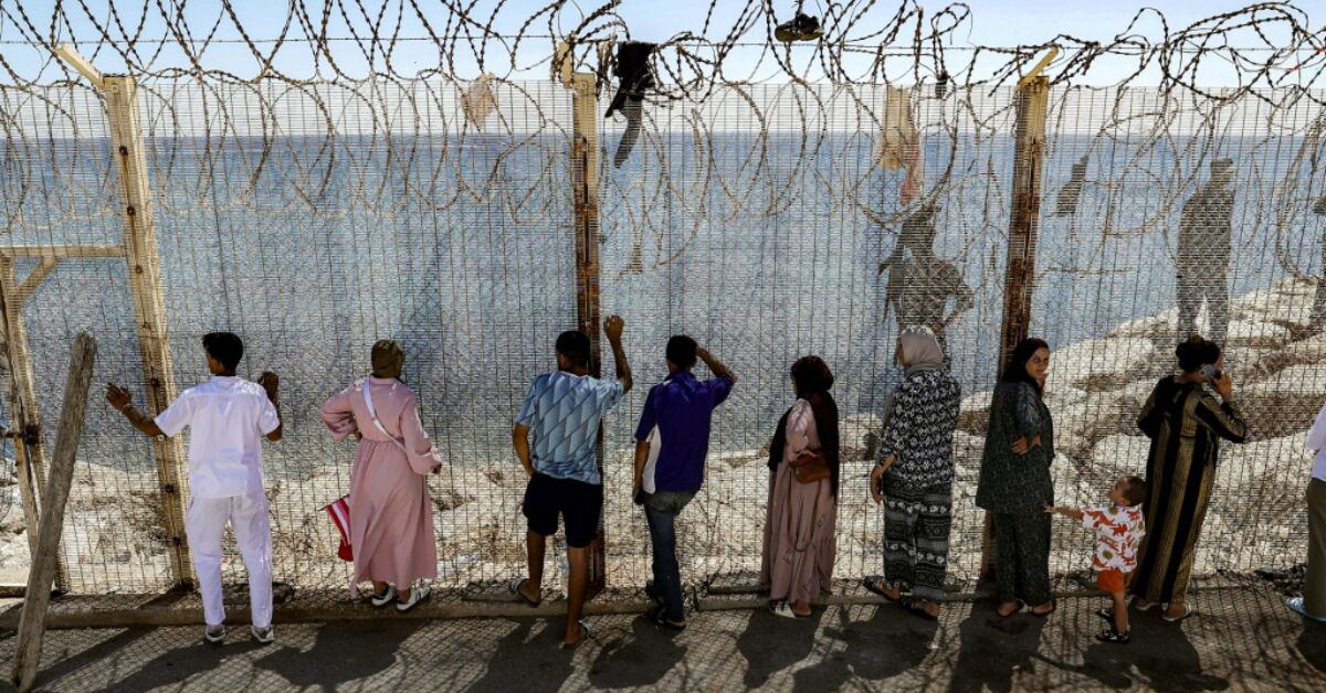 Moroccans gather at Ceuta border, desperate for news of loved ones