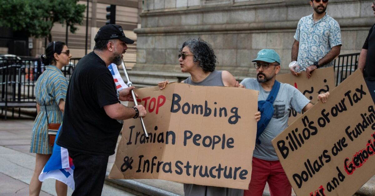 Protesters for and against the Iran war confront each other during a rally in the US city of Boston on Sunday