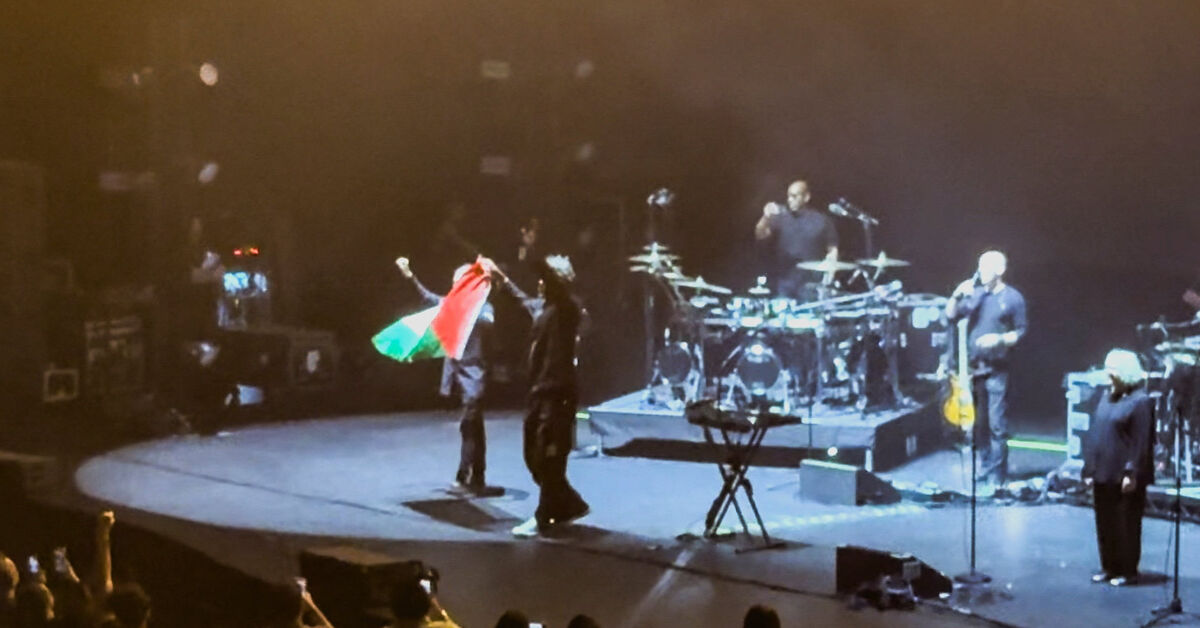 Massive Attack says Singapore police detained band after Palestinian flag display