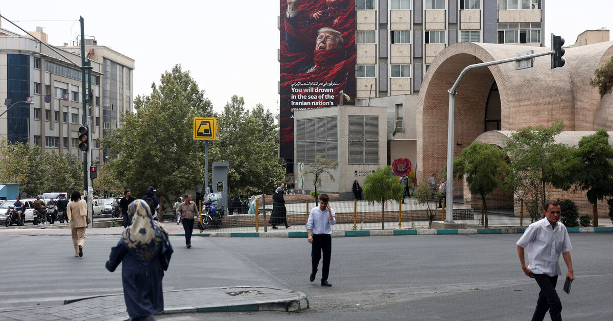 A billboard depicting U.S. President Donald Trump and Israeli Prime Minister Benjamin Netanyahu that reads "You will drown in the sea of the Iranian nation's revenge", on a building in Tehran, Iran, August 3, 2026. Majid Asgaripour/WANA (West Asia News Agency) via REUTERS