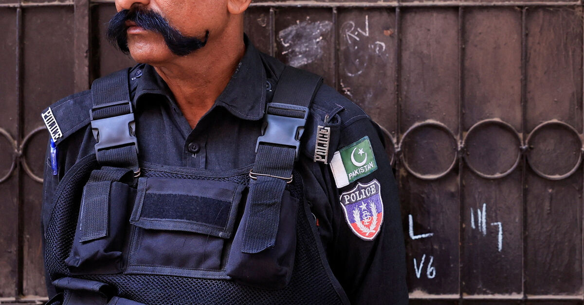 A police officer stands guard outside the home of a Christian family, following allegations of blasphemy and alleged desecration of the Koran, in Karachi, Pakistan, July 17, 2026. REUTERS/Akhtar Soomro