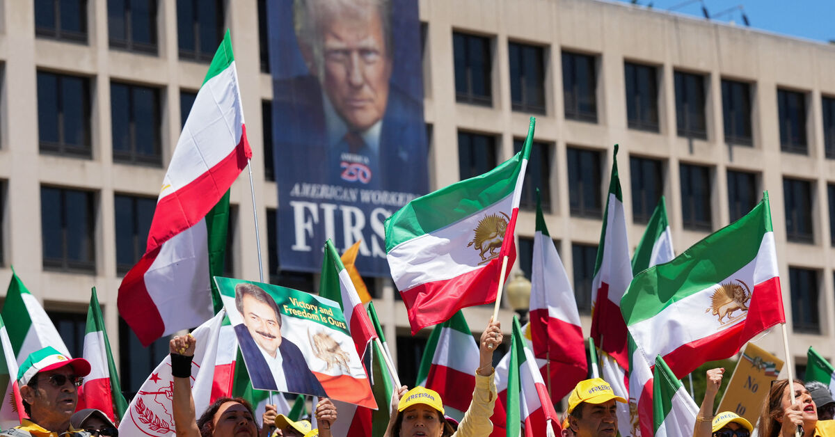 Iranian Americans and supporters of the National Council of Resistance of Iran take part in a march passing in front of the U.S Department of Labor building with a banner with the image of U.S. President Donald Trump, in Washington, D.C., U.S., May 16, 2026. REUTERS/Ken Cedeno