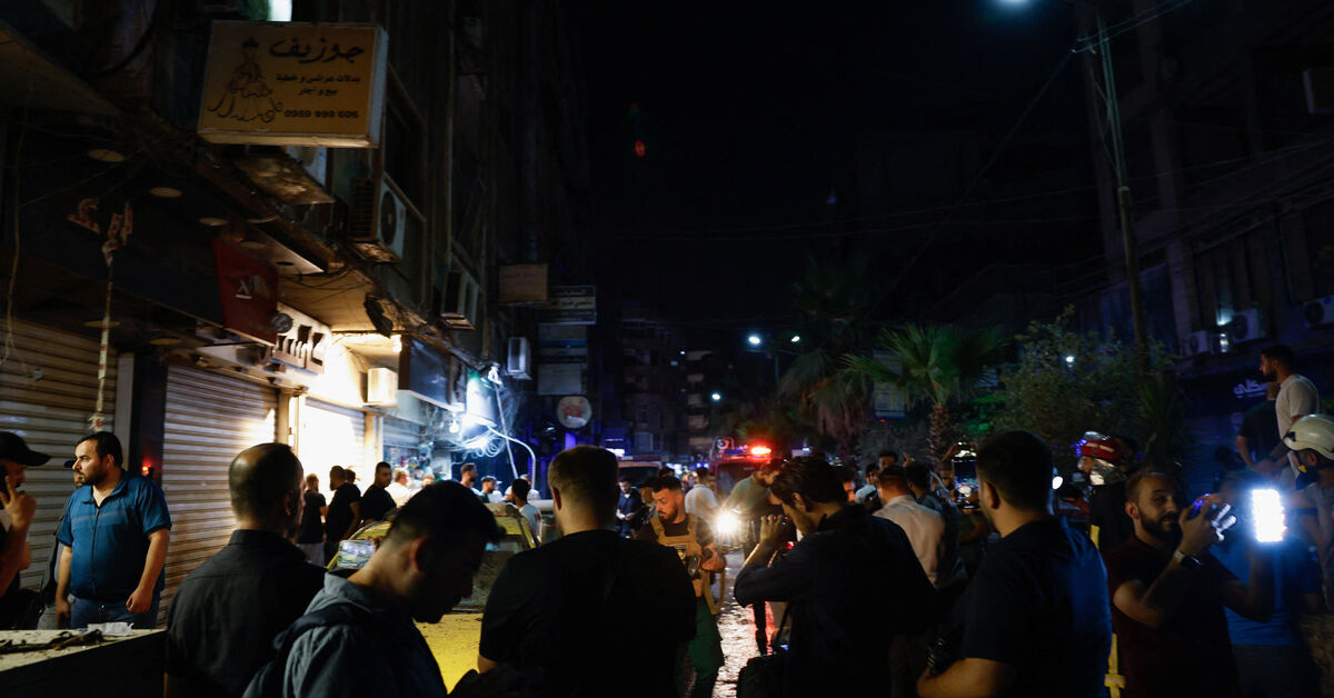 People gather at the site of an explosion, in Jaramana, Damascus countryside, Syria, August 6, 2026. REUTERS/Yamam Al Shaar