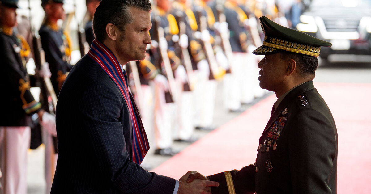 FILE PHOTO: U.S. Defense Secretary Pete Hegseth and Chief of Staff of the Armed Forces of the Philippines Romeo Brawner Jr shake hands at Camp Aguinaldo, in Quezon City, Metro Manila, Philippines, March 28, 2025. REUTERS/Lisa Marie David/File Photo