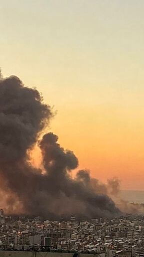 Smoke rises over Beirut's southern suburbs after an Israeli strike targeted Hezbollah's headquarters on Friday afternoon