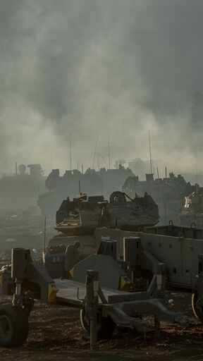 ISRAEL - LEBANESE BORDER, UPPER GALILEE, - SEPTEMBER 30: Israeli tanks and APC's gather by the Israeli - Lebanese border on September 30, 2024. Amid Israel's escalating campaign against Hezbollah in Lebanon, speculation continues over a possible ground offensive. Last week, Israeli Chief of Staff Lt. Gen. Herzi Halevi said Israel's recent airstrikes were designed to "prepare the ground for your possible entry and to continue degrading Hezbollah." (Photo by Erik Marmor/Getty Images)