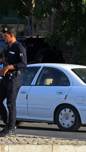 Iraqi security personnel patrol along a street in Baghdad on June 28, 2026. Iraqi authorities arrested 47 officials, including members of parliament, on June 28 as part of an anti-graft campaign in the corruption-plagued country, state media reported. (Photo by AHMAD AL-RUBAYE / AFP via Getty Images)